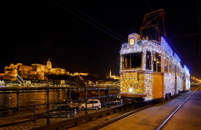 The Christmas Tram and the Buda castle are seen at the Vigado square.