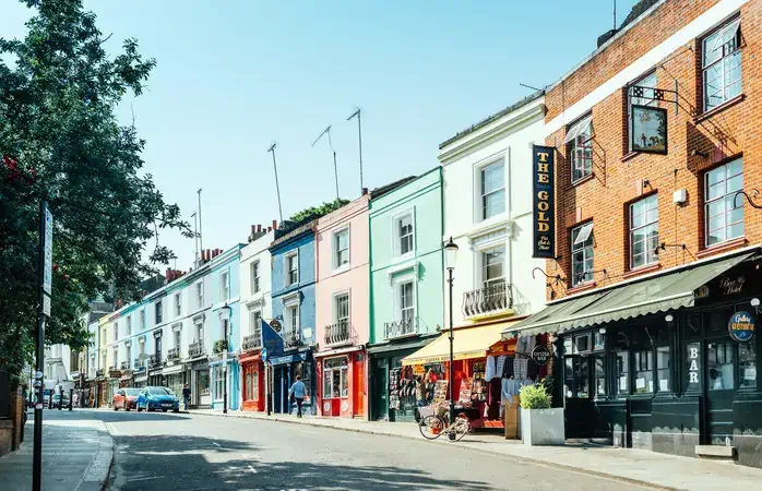 London, United Kingdom - May 25, 2017 : Portobello Road is a street in the Notting Hill district of the Royal Borough of Kensington and Chelsea in west London. It runs almost the length of Notting Hill from south to north, roughly parallel with Ladbroke Grove. On Saturdays it is home to Portobello Road Market, one of London's notable street markets, known for its second-hand clothes and antiques.