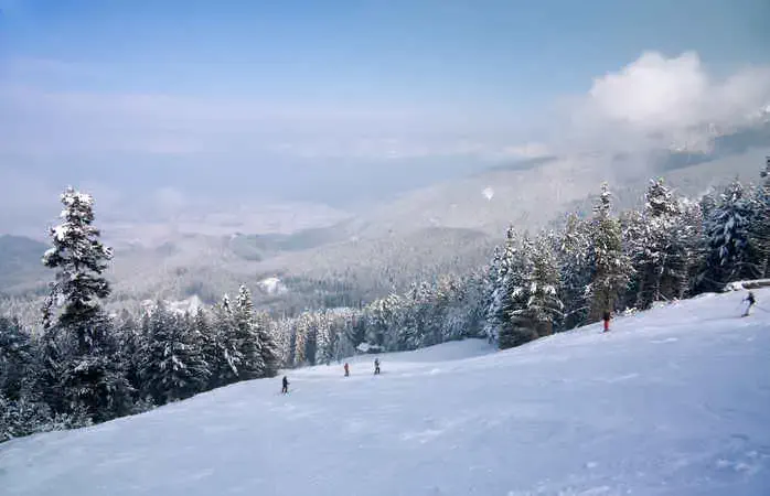 Ski slope and winter mountains panorama. Resort Bansko, Bulgaria
