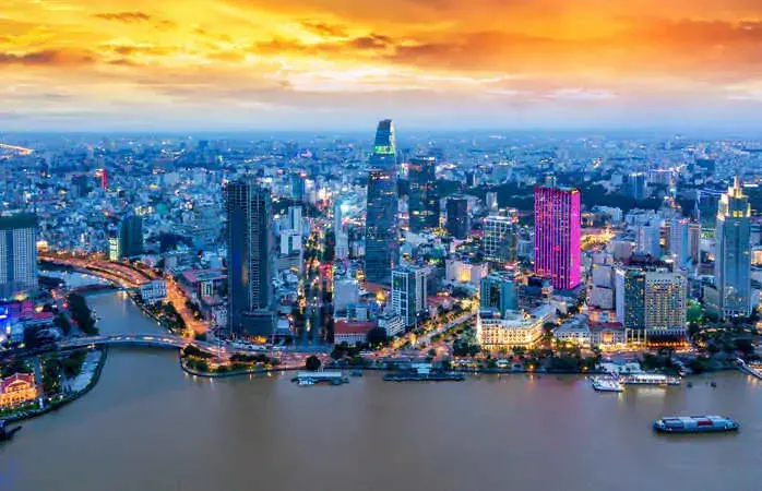 Aerial view of Ho Chi Minh City skyline and skyscrapers in center of heart business at Ho Chi Minh City downtown. Panorama of cityscape on Saigon river in Ho Chi Minh City at Vietnam at sunset scene; Shutterstock ID 1172320828