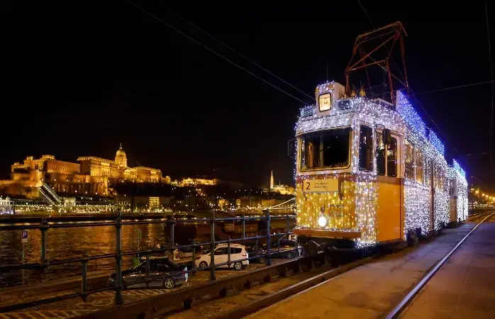 The Christmas Tram and the Buda castle are seen at the Vigado square.